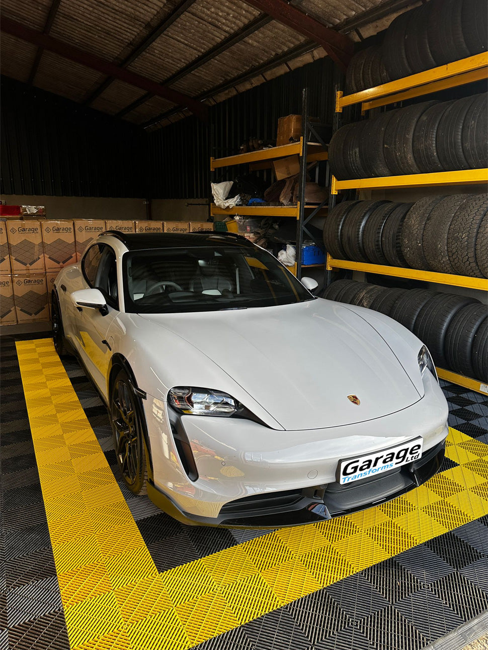 Car on black and yellow vented tiles